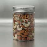 جار پت شفاف 700 سی سی دهانه 88 مناسب بسته‌بندی خشکبار و آجیل با درب فلزی پیچی، محصول پلادیو پلاست