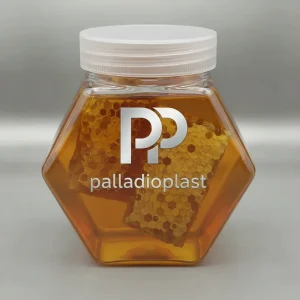 جار پلاستیکی پت 700 سی سی مدل کندو (شش ضلعی) حاوی عسل طبیعی، با درب پ پ شفاف